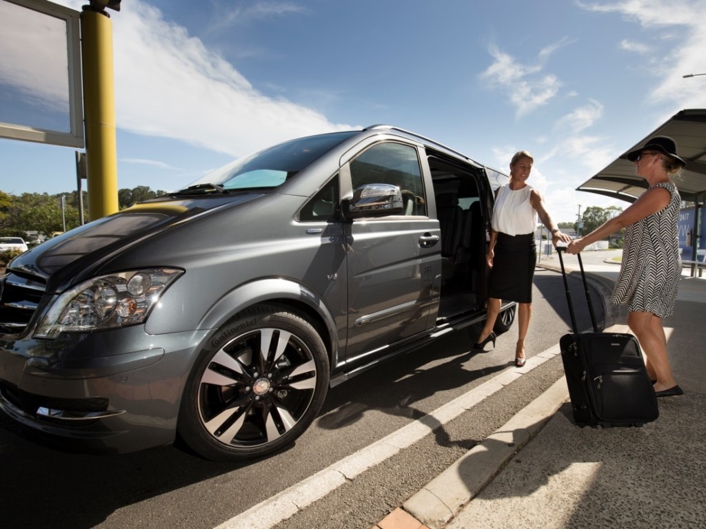 Airport transfer minivan with travelers